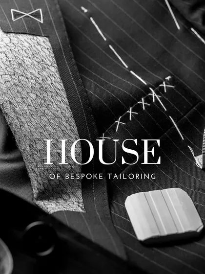 This is where it all begins. A glimpse into the house of bespoke tailoring, where every garment starts as a pattern and a vision. The basting stitches you see are temporary, holding the suit together for a fitting, ensuring the final product is nothing short of perfect.