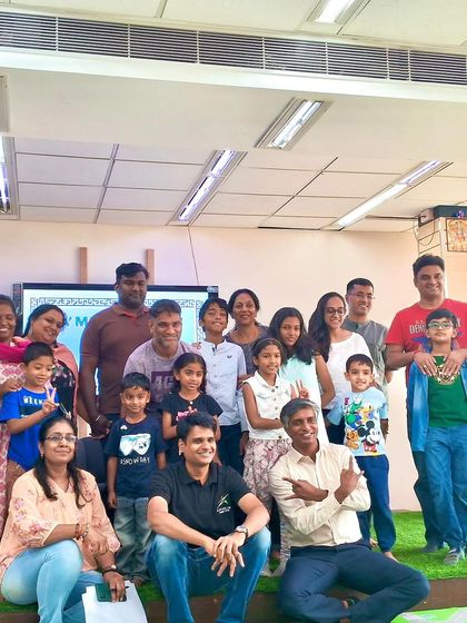 A fantastic group photo capturing the proud smiles of all the kids, parents, and mentors at the end of a successful LEGO Mindgym workshop. This is what our creative community looks like!