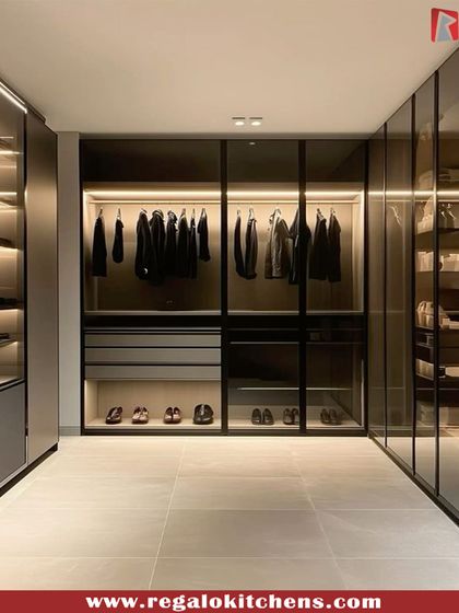 Minimalism meets luxury in this design. We used smoked glass doors and subtle backlighting to create a sleek, gallery-like space where the focus remains on the curated wardrobe within.