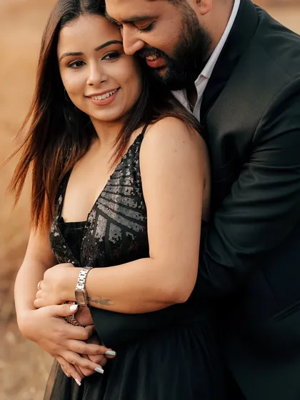A close-up portrait showing the couple in a warm embrace. The focus on their happy expressions captures the love and security they find in each other.