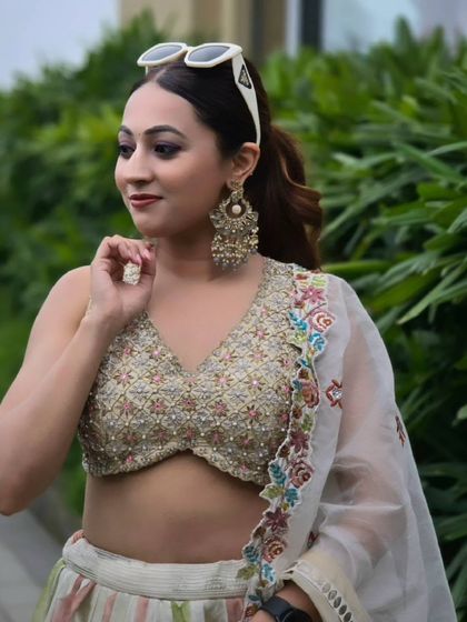 My Haldi look for the day. A beautiful embroidered blouse paired with a simple lehenga and statement earrings is a perfect choice for a daytime event.