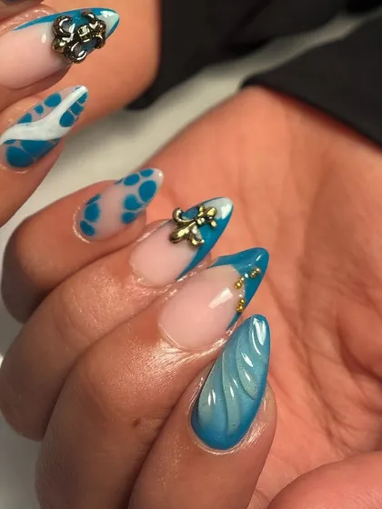 A detailed shot of the blue marble, spots, and 3D charm. I love how all the different elements play together in this creative manicure.