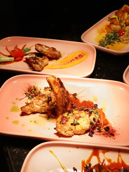 A trio of Pan-Asian preparations, each with its own unique sauce and garnish, showcasing the diversity and artistry of our oriental cuisine.