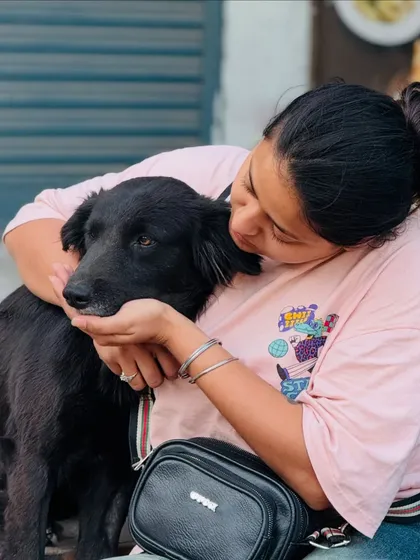Sharing a gentle moment with a black street dog. Every animal deserves kindness and a soft touch.
