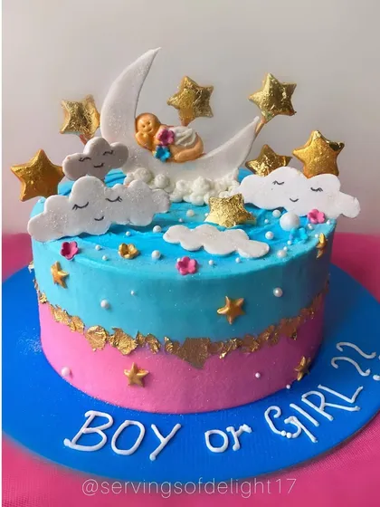A dreamy "Twinkle Twinkle Little Star" themed baby shower cake. The design features a baby sleeping on the moon surrounded by fondant stars and clouds.