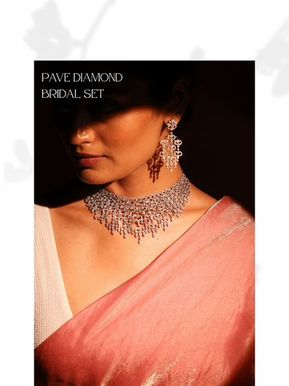 This Pave Diamond Bridal Set offers a breathtaking display of pure brilliance. Worn here, the necklace and earrings create a cohesive look of cascading light, perfect for a glamorous bridal statement.