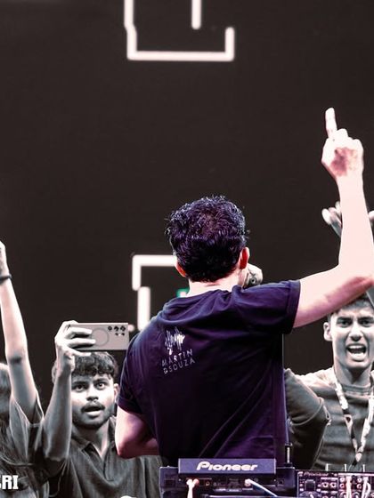 The view from behind, with students reaching out from the front row. This connection with the audience is everything.