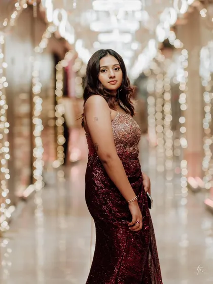 The full look in a beautifully lit hallway. The makeup and outfit come together to create a truly magical and unforgettable reception style.