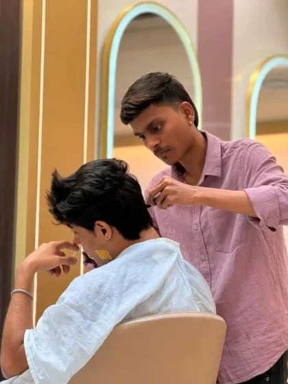 Sharp cut, clean finish, confident look. Our stylist is focused on delivering a precision haircut for this client.