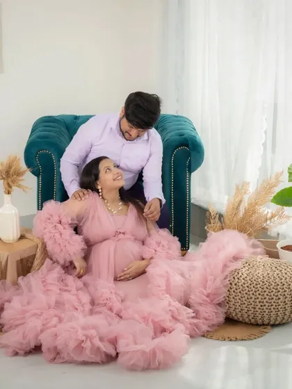 A fairytale moment. The way they look at each other, surrounded by the soft fabric of her gown, feels like a scene from a storybook.