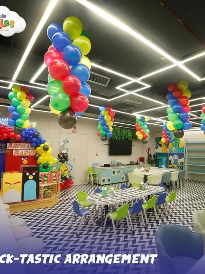 A wide view of our party hall decorated for an Angry Birds theme. The colorful balloon arrangements and themed table setups show how I transform the entire space to match your child's dream.