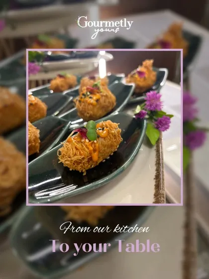 Crispy, golden-brown appetizers served on individual spoons. This image highlights the elegant presentation and texture of our bite-sized creations.