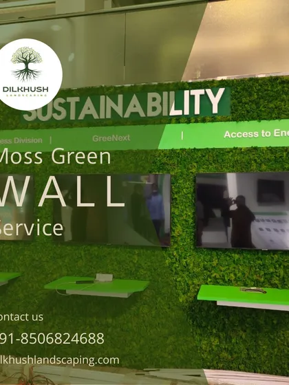A close-up of our moss green wall service for a corporate client. The wall features integrated branding and shelving, creating a functional and visually striking feature in the office space.