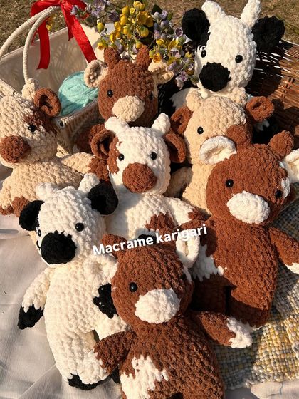 A basket full of our handmade chunky yarn cows. These are a popular choice for bulk orders, especially as return gifts for birthday parties.