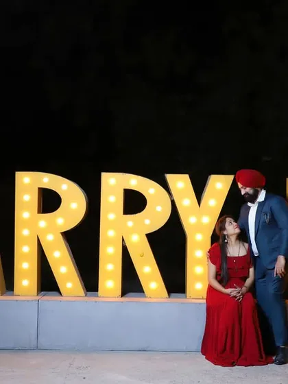 A grand proposal setup at The Picture Town, using large marquee lights for a dramatic night-time shot. This is a popular choice for couples wanting a bold, cinematic statement for their pre-wedding album.