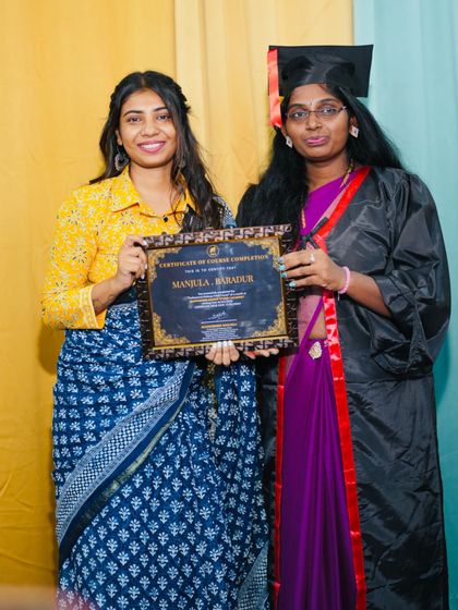 A proud teacher moment, handing over the certificate of completion.