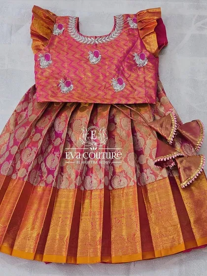 A lovely 6-month-old Pattu lehenga in shades of pink and orange, ready for immediate dispatch.