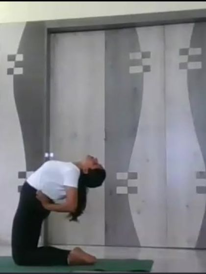 An instructor performs Ustrasana (Camel Pose) in an online class, showcasing a deep backbend that opens the heart and improves posture. We guide students safely into such postures with detailed instructions.