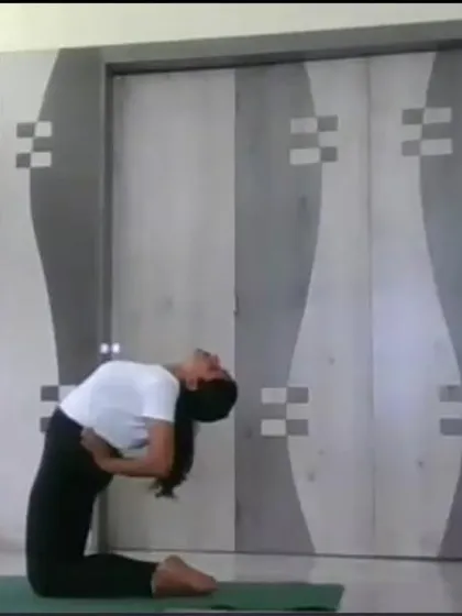 An instructor performs Ustrasana (Camel Pose) in an online class, showcasing a deep backbend that opens the heart and improves posture. We guide students safely into such postures with detailed instructions.