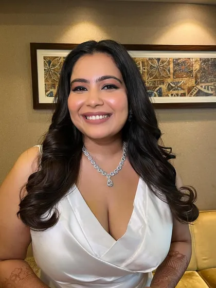 For Shraddha's white wedding, we created a classic and timeless look. It featured matte eyes with a clean, sharp liner, a beautiful glow on the face, and a muted lip color that perfectly complemented her elegant white gown.