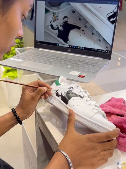 A shot of me painting live at an Adidas store event. I love interacting with people and creating art on the spot.