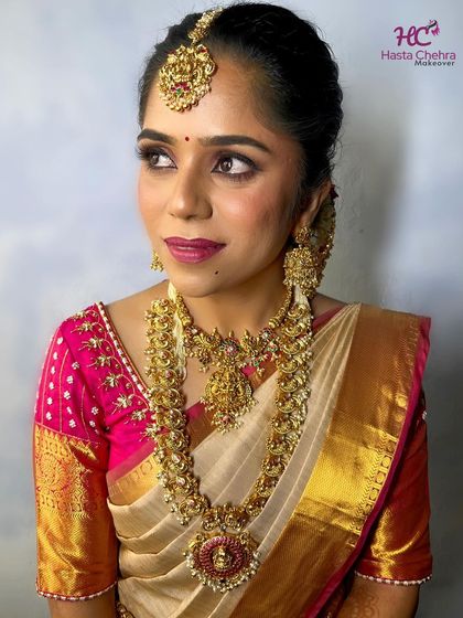 A close-up showcasing the divine details of the temple jewellery. The intricate carvings and the beautiful Kemp stone in the pendant are highlighted in this shot.