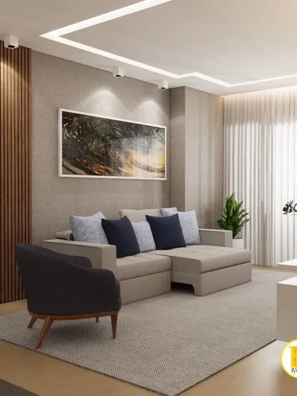 A calm and inviting living room with a neutral sofa and a dark accent chair. The large artwork and textured wall panel add visual interest.
