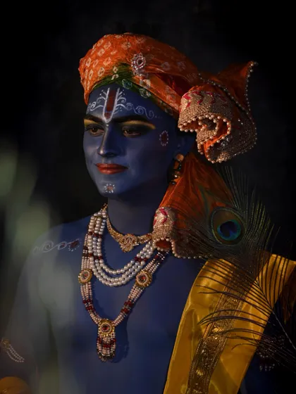 A student's artistic representation of Lord Krishna, using body paint and traditional accessories. Our courses cover character and mythological makeup.