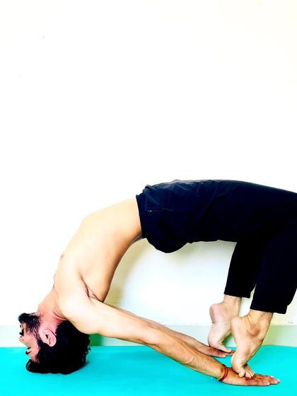 A variation of bridge pose, lifting high onto the toes to intensify the backbend and glute engagement.