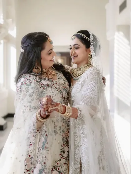 A bride sharing a laugh with her sister. The bond between siblings is a special part of any wedding celebration.