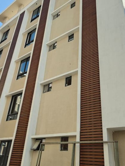 Here, our wood-finish metal louvers add warmth and texture to this building's elevation. It's a perfect example of how we use cladding to break the monotony of a plain wall and add character.