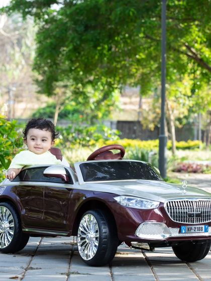This little one is enjoying the view from his convertible, ready for a sunny day drive.