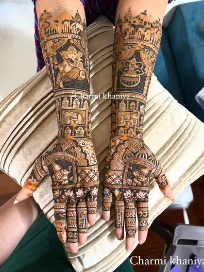 A fully customized design celebrating faith and tradition. This client wanted Lord Ganesha, a sacred kalash, and other personal elements woven into a full-arm mehendi masterpiece.