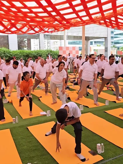 A diverse group of employees participating in a yoga session. My classes are designed to be inclusive and beneficial for people of all ages and fitness levels.