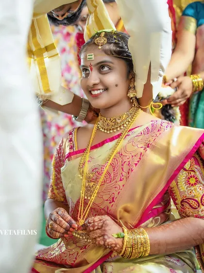 The bride's joyful upward glance as the sacred knot is tied. This is a pinnacle moment of a Telugu wedding, and we capture the pure emotion and significance of the tradition.