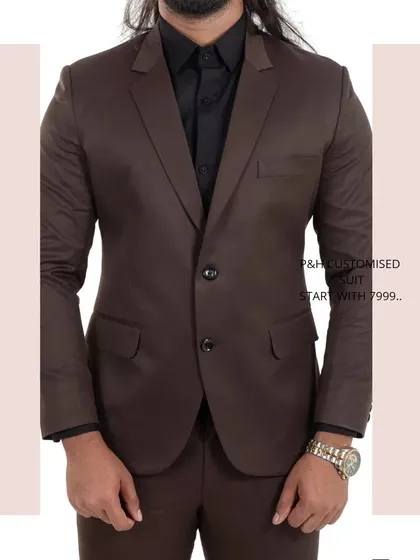 A close-up of the brown suit jacket, a timeless piece for any formal occasion.