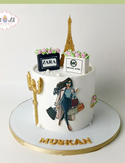 A slice of Parisian chic for Muskan's birthday. This cake features a fashion illustration, edible shopping bags from Zara and Michael Kors, and a golden Eiffel Tower topper.