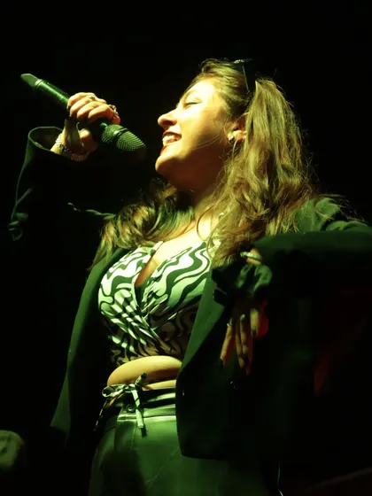 A candid shot capturing a moment of pure joy while hosting on stage. I truly love what I do, and I think it shows.