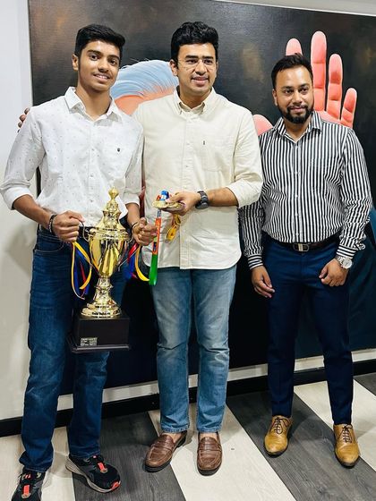 A closer shot of Akash K J and MP Tejasvi Surya, highlighting the appreciation for his national-level table tennis achievements.
