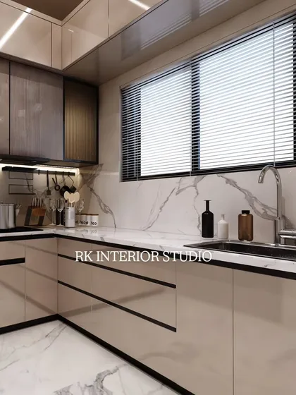A 3D render showcasing a luxury modular kitchen with acrylic finish cabinets and sleek profile handles. The design includes a beautiful marble backsplash and warm under-cabinet lighting.