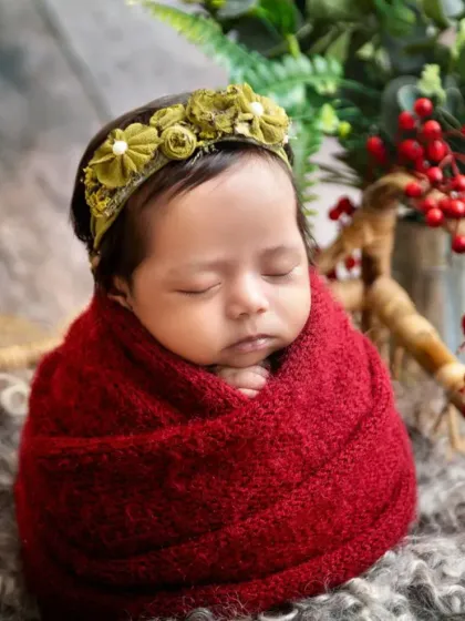 Even with a different colored headband, the deep red wrap creates a cohesive and beautiful series of photos for this little girl's newborn session.