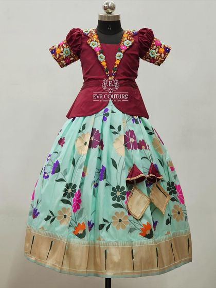 A modern lehenga with a floral print skirt and a blouse with a stylish embroidered collar.