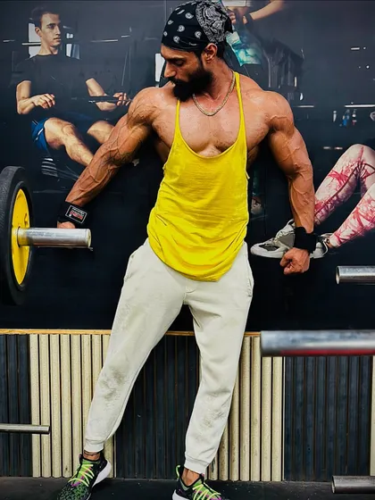 Determination in action. This member is focused on building lean muscle and definition, a testament to consistent training and a solid nutrition plan.