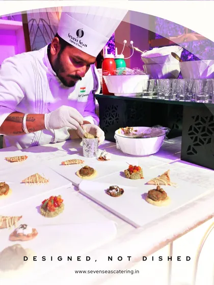 Designed, Not Dished. Our chef meticulously arranges canapés, embodying our core belief that every dish should be a work of designer art.