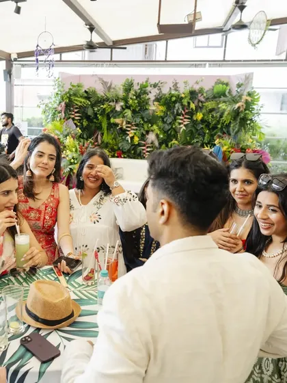 Sharing a laugh with guests at a vibrant daytime wedding event. My walk-around magic is designed to blend seamlessly into the party, adding a layer of fun and surprise without interrupting the flow.