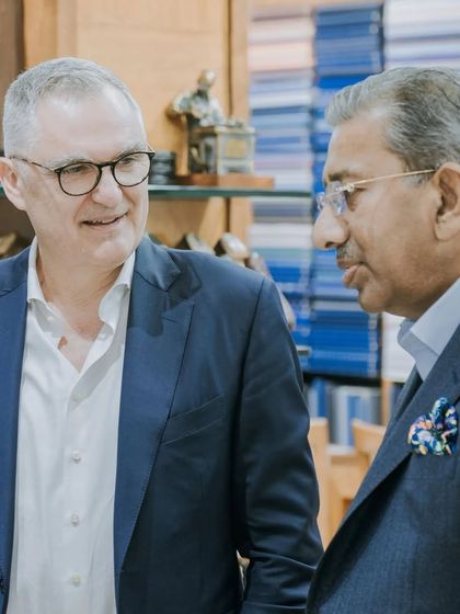 A conversation between leaders in the luxury textile and tailoring industries. This image captures a moment of shared vision during the visit from the Scabal executive team.