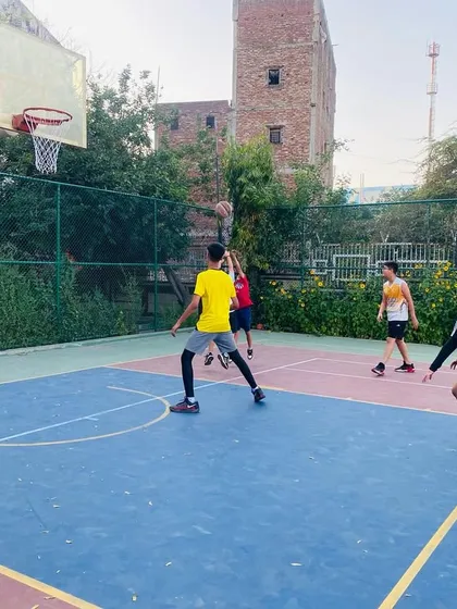 A player goes up for a layup, showing the elevation and form we practice.
