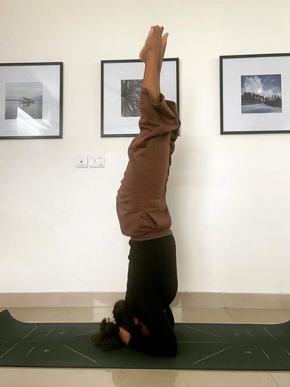 Shirshasana (Headstand). I am constantly aiming for balance in life, both on and off the mat, to rise above the dualities of pleasure and pain.
