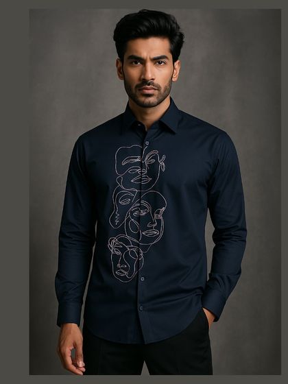 A full-frame shot of the navy abstract shirt, showing its tailored fit and how the embroidery serves as a central artistic statement.