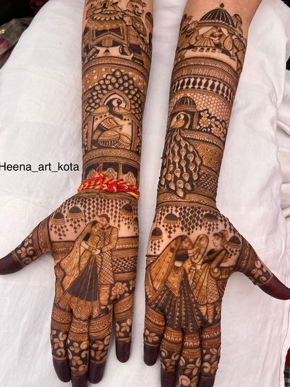 A beautiful and intricate full bridal design featuring couple portraits and peacock motifs.